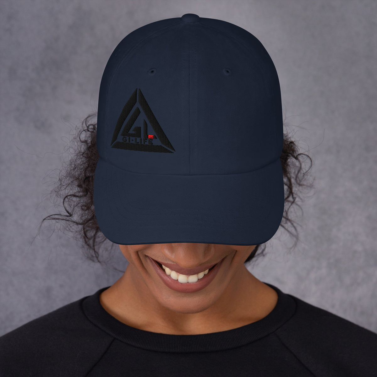 Navy Jiu Jitsu Vibes dad hat with embroidered triangle logo, front view on model