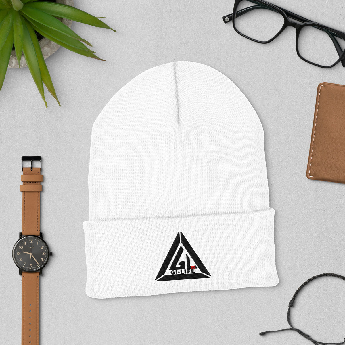 White cuffed beanie with embroidered black Jiu Jitsu Vibes triangle logo